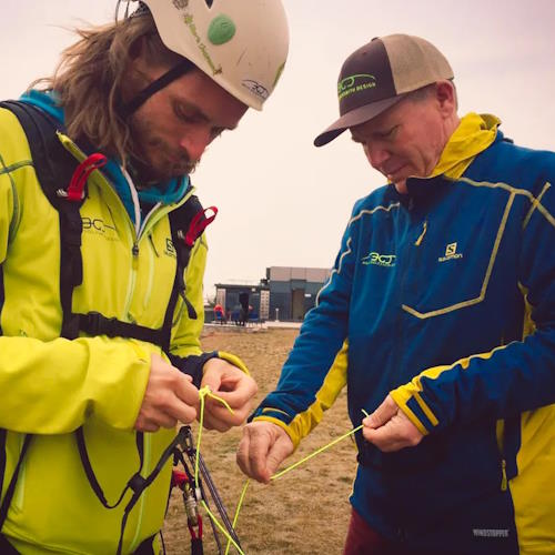 Karlis Jaunpetrovičs as BGD test pilot 2016–2018, with founder Bruce Goldsmith working on a paragliding wing.