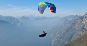 Flying Karlis SIV course over Lake Garda — pilot over water during a paragliding SIV clinic in Italy.
