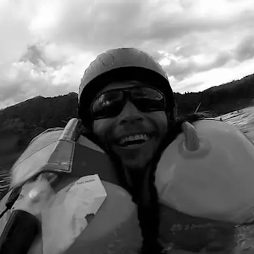 Karlis Jaunpetrovičs practicing paragliding acrobatic maneuvers over water — SIV training origins.